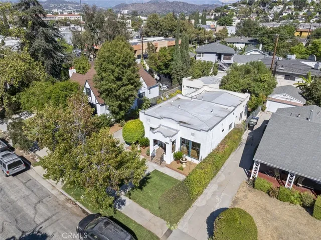 an aerial view of a house with a garden