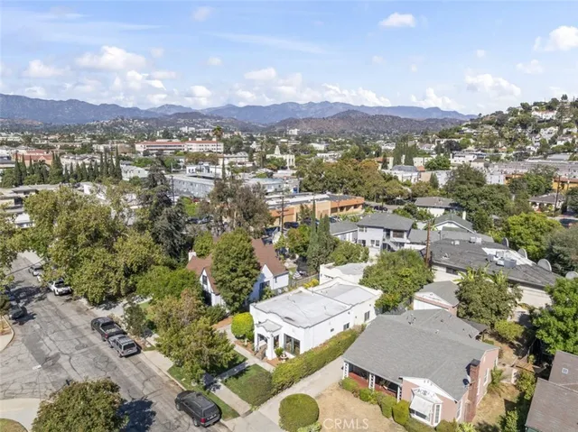 an aerial view of residential houses with outdoor space