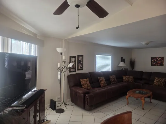 a view of dining room with furniture window and wooden floor