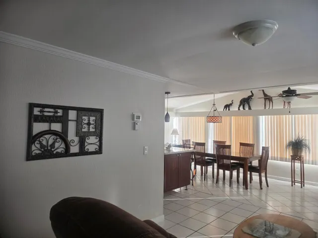 a kitchen with granite countertop wooden cabinets a sink and a oven