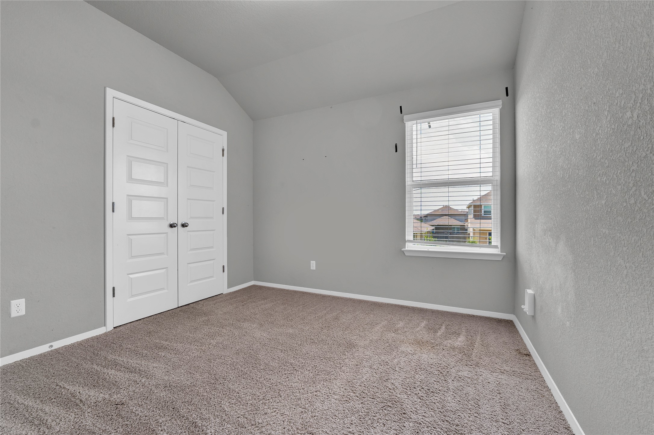 101 Crescent Street Georgetown, TX 78626 - Photo 27 of 39 Bedroom #3 features vaulted ceilings and plush carpeting, creating a comfortable living space.