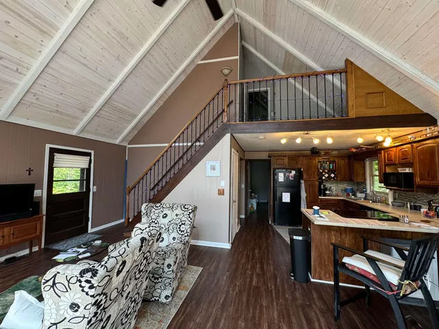 a view of a livingroom with furniture and window