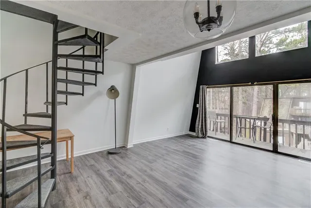 a kitchen with a refrigerator stove and cabinets