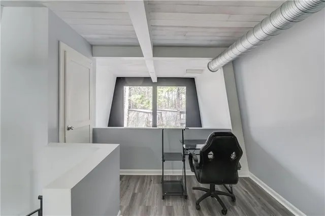 a bathroom with a bathtub shower sink vanity and toilet