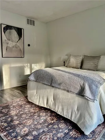 a view of a patio with swimming pool and sitting area