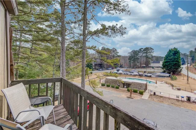 an aerial view of a house with a swimming pool