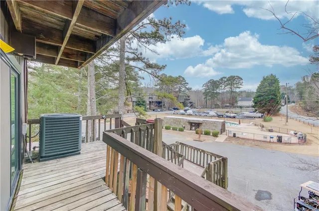 a view of entryway with wooden floor and seating space