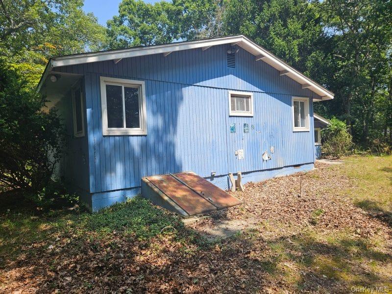51 Shore Road Hampton Bays, NY 11946 - Photo 11 of 19 a backyard of a house