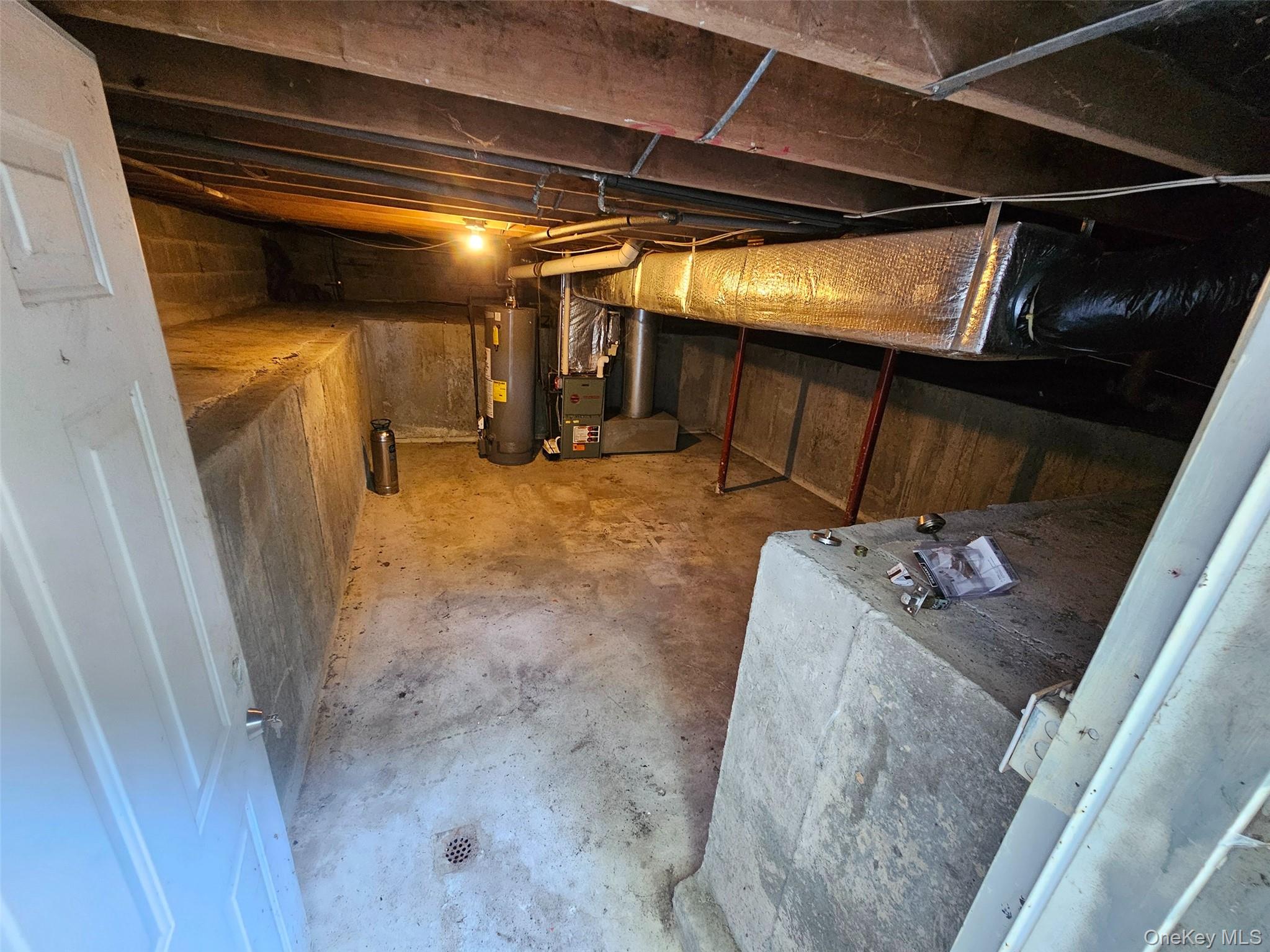 51 Shore Road Hampton Bays, NY 11946 - Photo 15 of 19 a water heater room