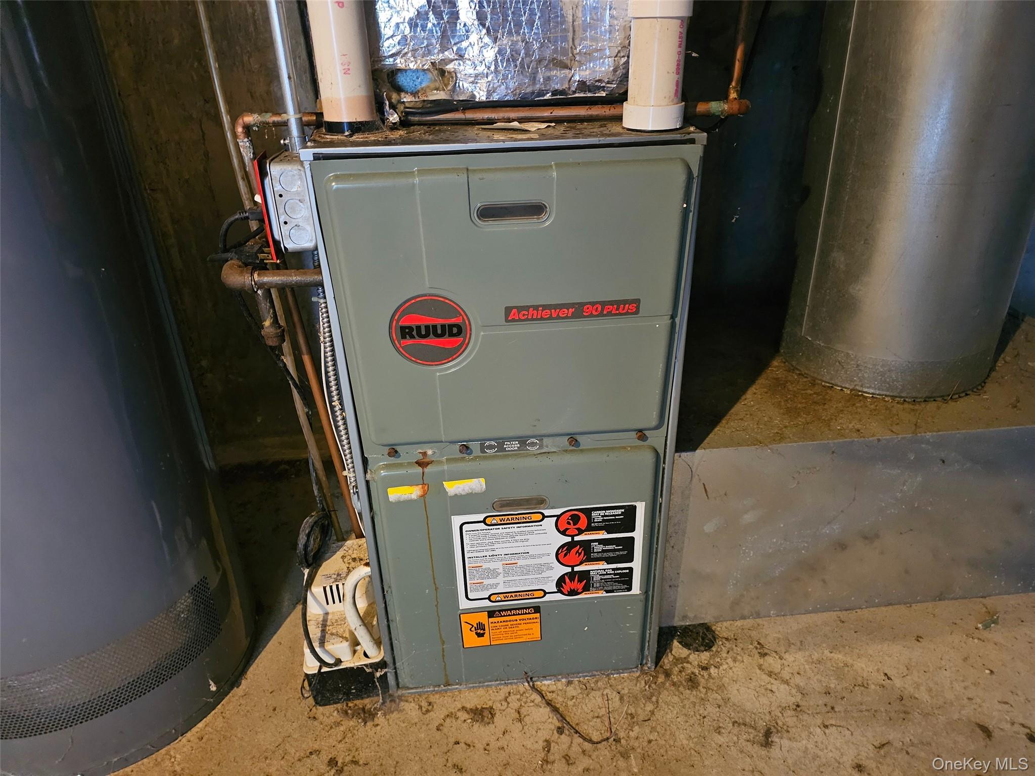 51 Shore Road Hampton Bays, NY 11946 - Photo 16 of 19 a close view of water heater and washer