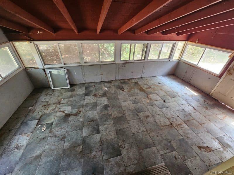 51 Shore Road Hampton Bays, NY 11946 - Photo 4 of 19 a view of an empty room with a fireplace