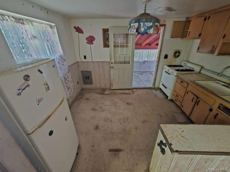 51 Shore Road Hampton Bays, NY 11946 - Photo 6 of 19 a bathroom with a bathtub and a shower