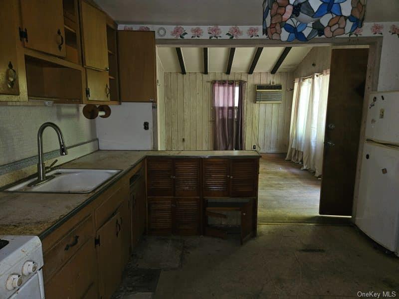 51 Shore Road Hampton Bays, NY 11946 - Photo 10 of 19 a bathroom with a sink and a mirror