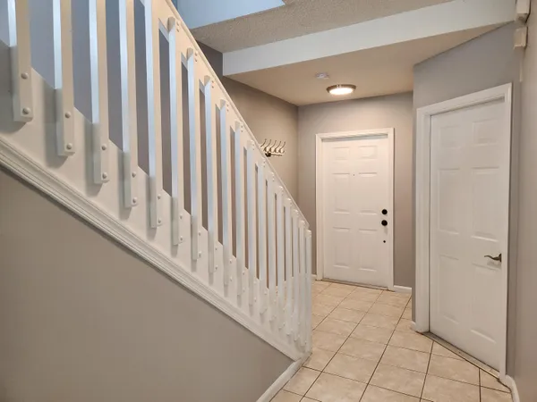 a view of a hallway with staircase