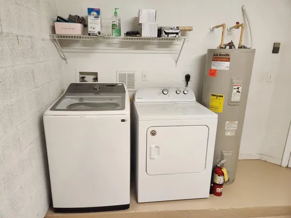 a utility room with dryer and washer