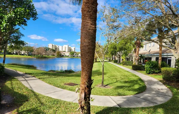 a view of a house with a yard and sitting area
