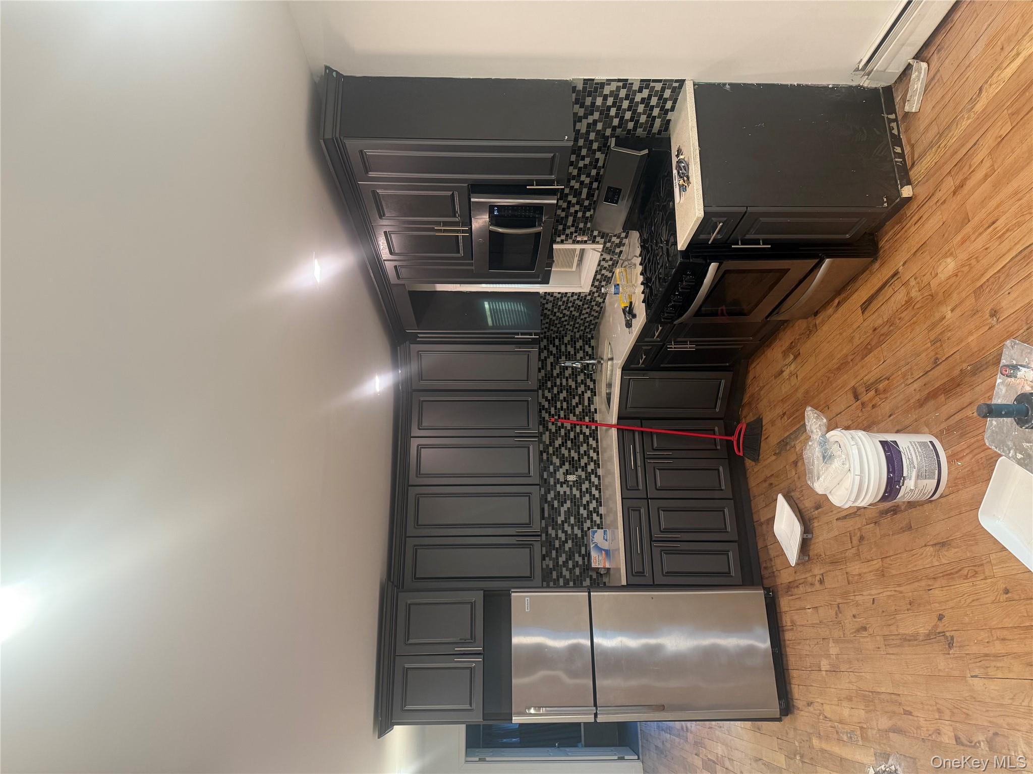 a kitchen with a sink and a stove top oven