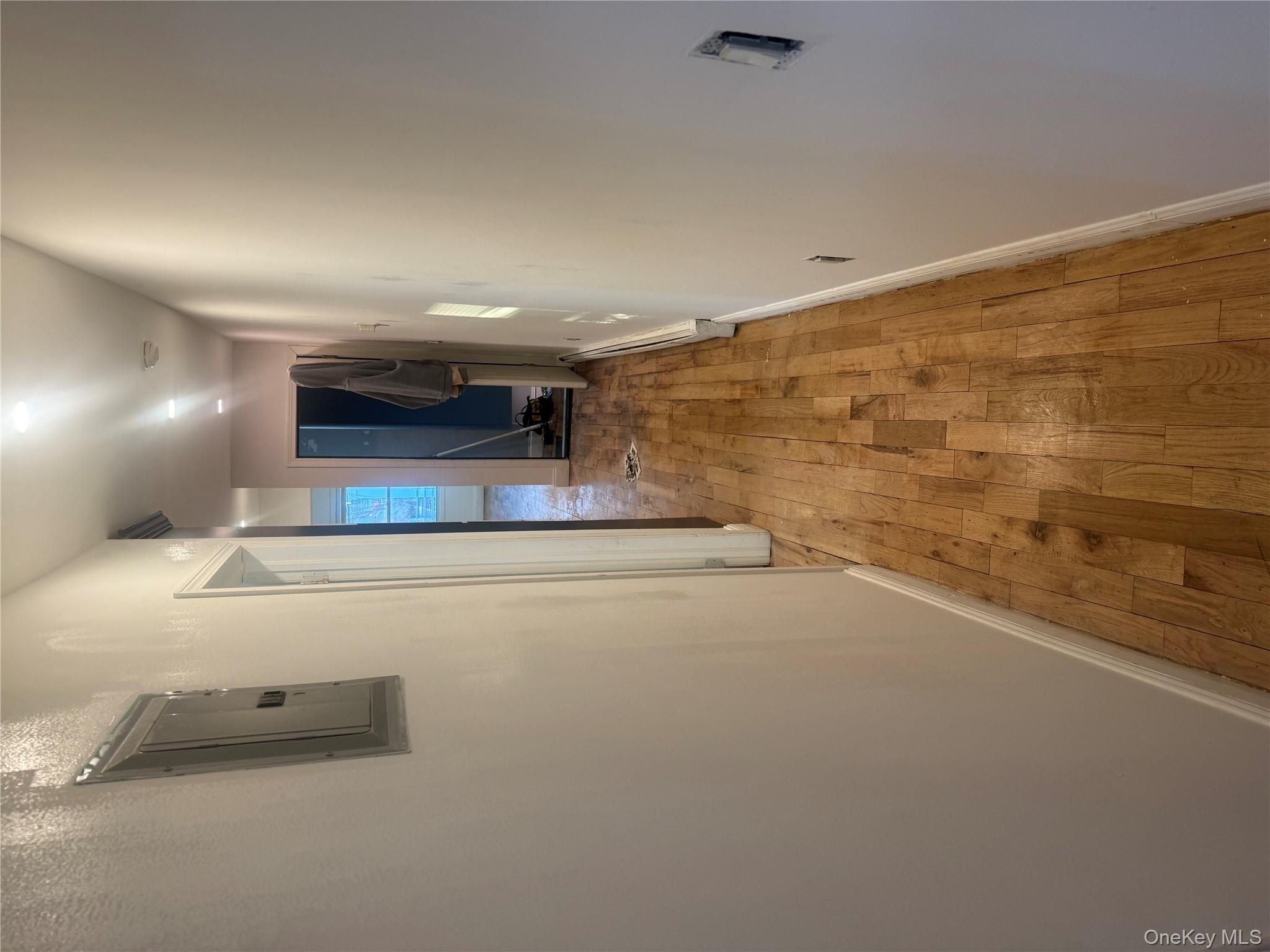 28 Clinton Avenue, Unit 2 Hempstead, NY 11096 - Photo 5 of 5 a view of hallway with wooden floor
