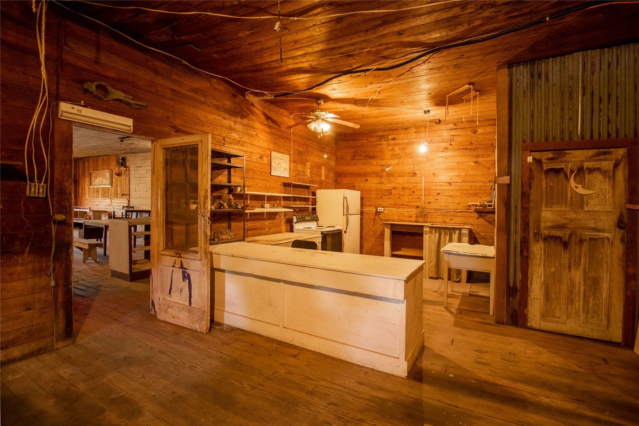 190 Fm 405 Street Huntsville, TX 77320 - Photo 11 of 15 a view of a refrigerator in kitchen and wooden floor