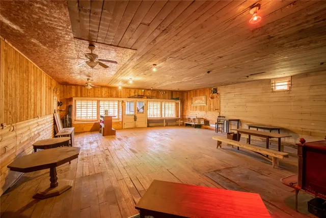a view of a refrigerator in kitchen and wooden floor