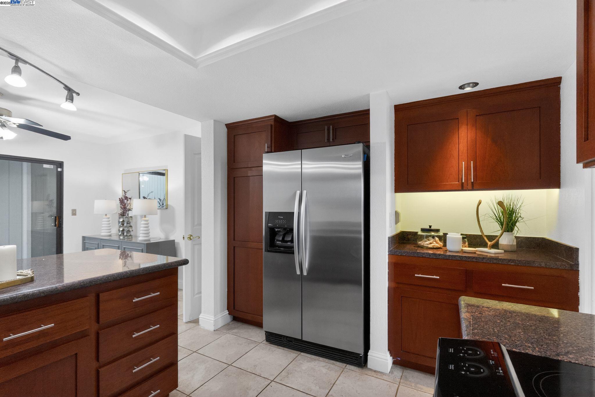 7210 Valley View Court Pleasanton, CA 94588 - Photo 11 of 44 a kitchen with a refrigerator and a sink