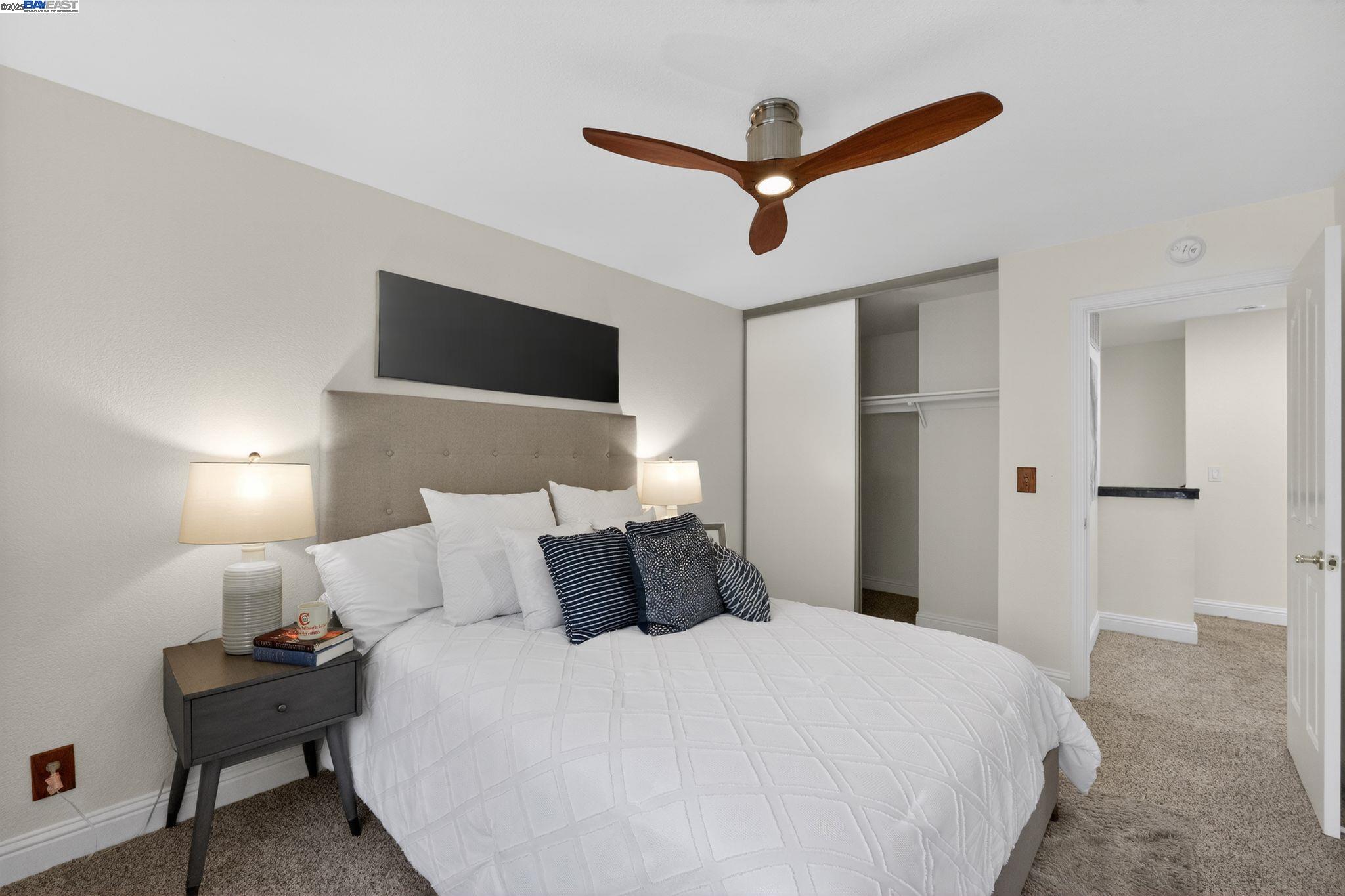 7210 Valley View Court Pleasanton, CA 94588 - Photo 15 of 44 a bedroom with a bed and a ceiling fan