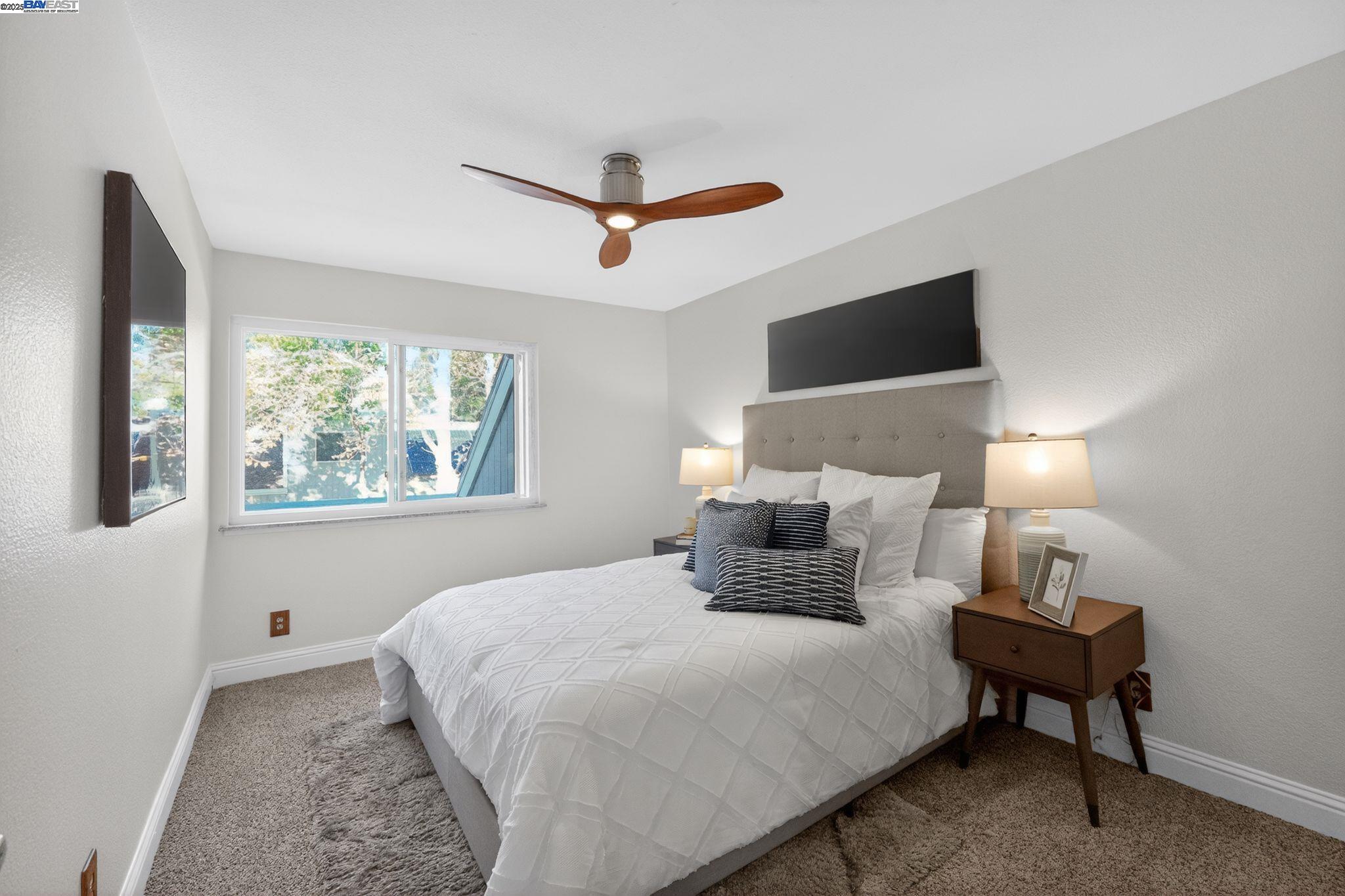 7210 Valley View Court Pleasanton, CA 94588 - Photo 21 of 44 a bedroom with a bed and a window