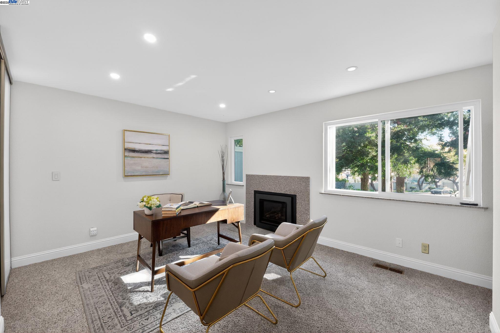 7210 Valley View Court Pleasanton, CA 94588 - Photo 28 of 44 a living room with furniture a fireplace and a window