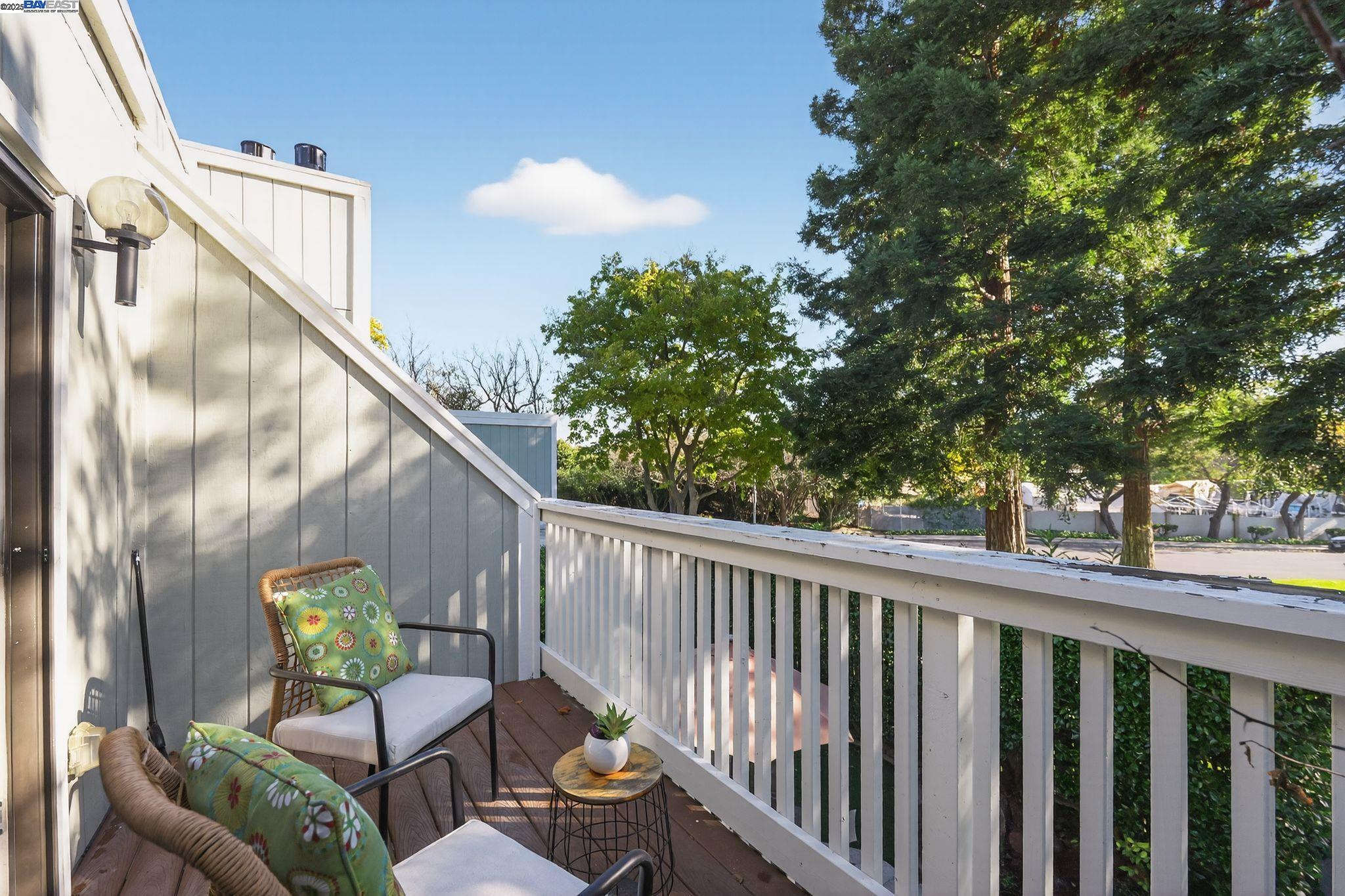 7210 Valley View Court Pleasanton, CA 94588 - Photo 31 of 44 a balcony with wooden floor stairs and bench