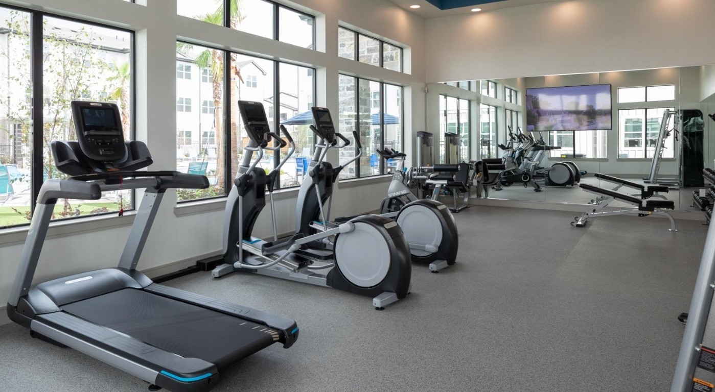 19770 Clay Road, Unit 11302 Katy, TX 77449 - Photo 33 of 35 a room with gym equipment and windows