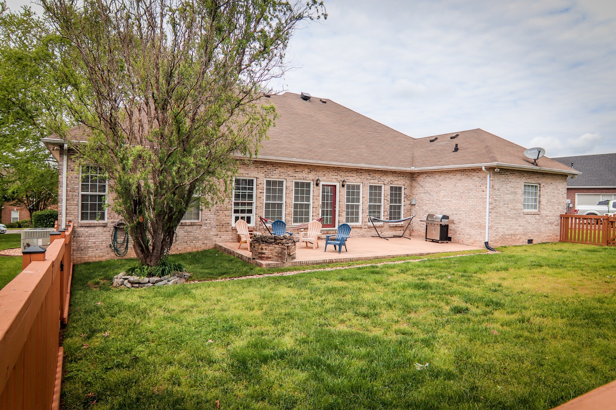 141 Hunters Ridge Drive Tullahoma, TN 37388 - Photo 5 of 49 a front view of a house with a garden and trees