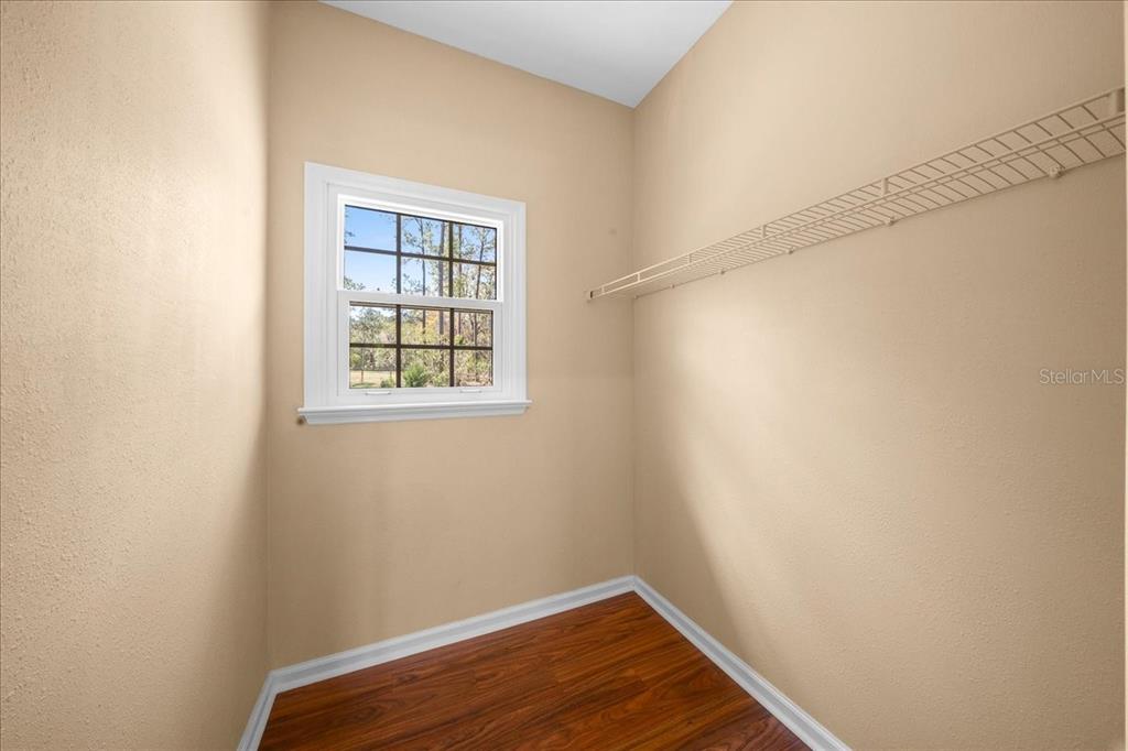 7808 Northeast 75th Street Gainesville, FL 32609 - Photo 28 of 78 a view of a room with wooden floor and small window