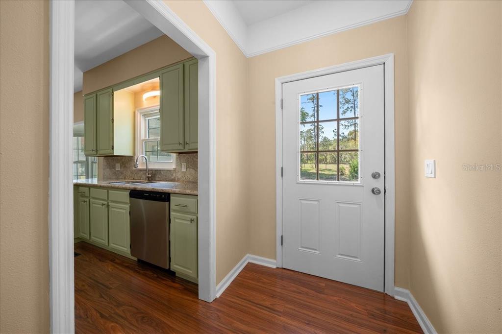 7808 Northeast 75th Street Gainesville, FL 32609 - Photo 29 of 78 a view of kitchen with wooden floor electronic appliances and window