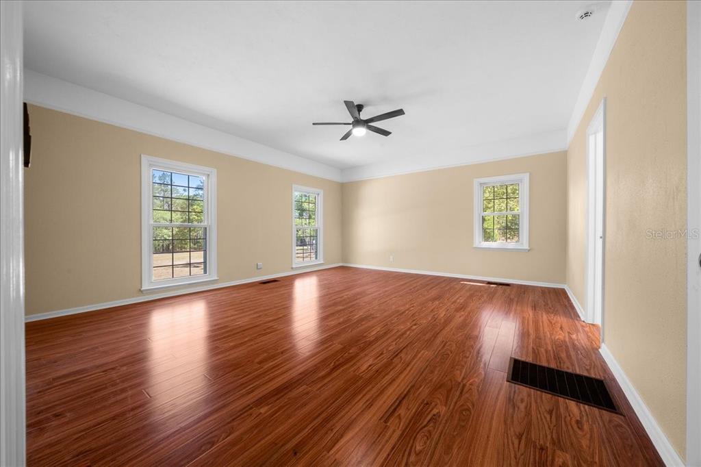 7808 Northeast 75th Street Gainesville, FL 32609 - Photo 33 of 78 wooden floor in an empty room with a window