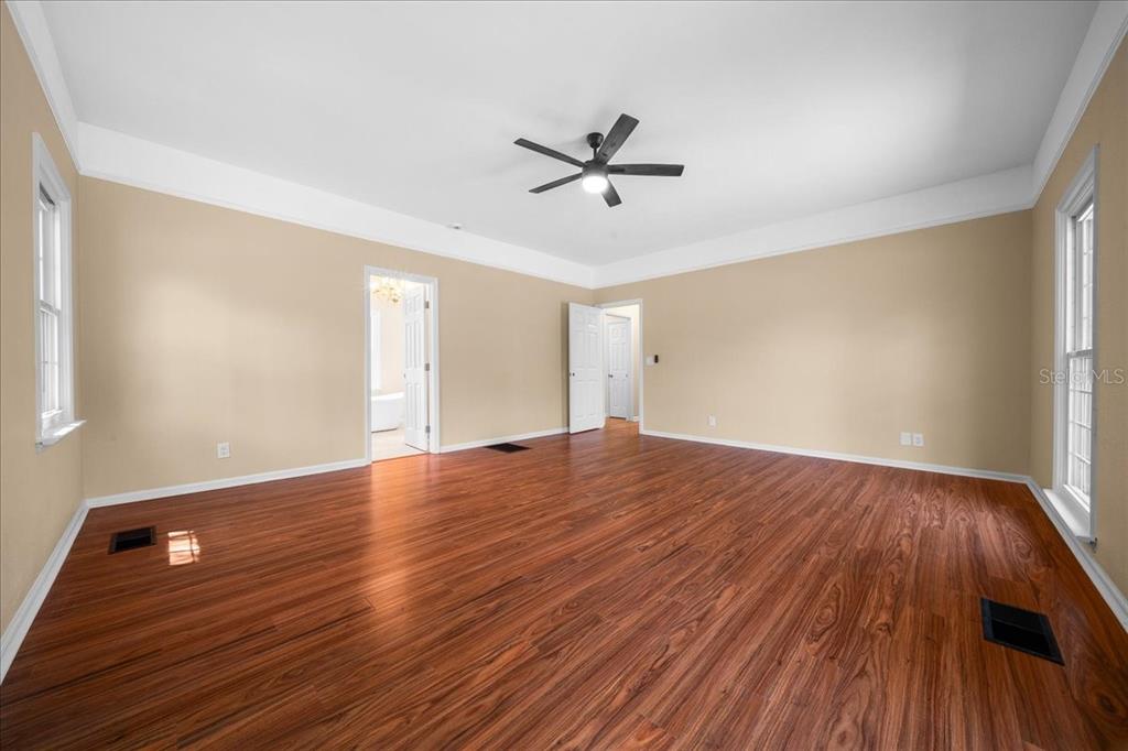 7808 Northeast 75th Street Gainesville, FL 32609 - Photo 34 of 78 wooden floor in an empty room with a window