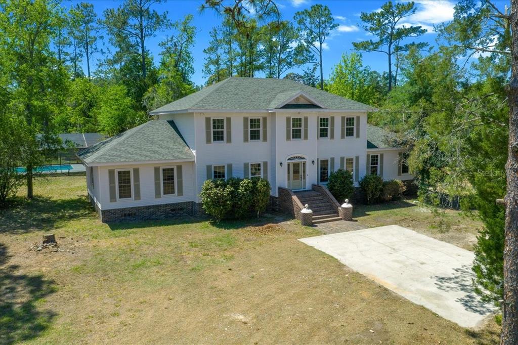 7808 Northeast 75th Street Gainesville, FL 32609 - Photo 4 of 78 a view of a house with a yard