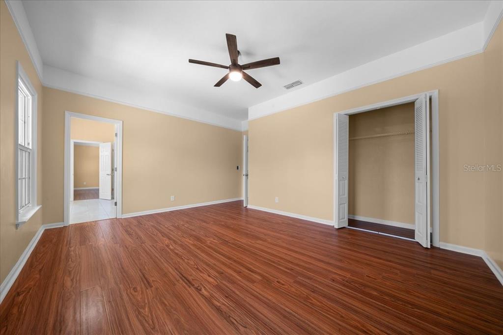 7808 Northeast 75th Street Gainesville, FL 32609 - Photo 48 of 78 a view of empty room with wooden floor