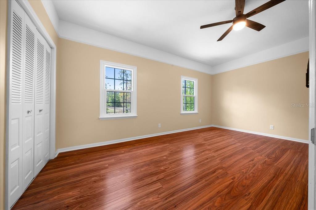 7808 Northeast 75th Street Gainesville, FL 32609 - Photo 50 of 78 a view of empty room with wooden floor and fan