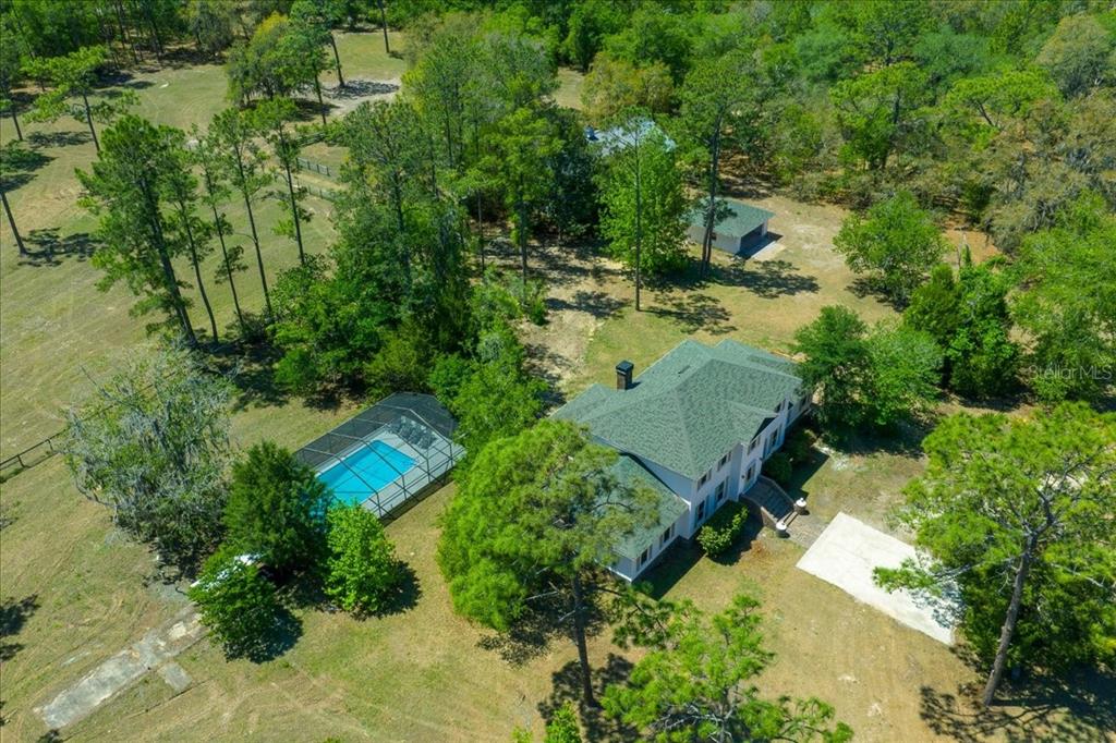 7808 Northeast 75th Street Gainesville, FL 32609 - Photo 61 of 78 an aerial view of a house with a yard