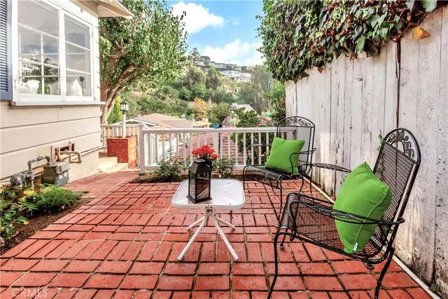 a view of a chairs and tables in the patio