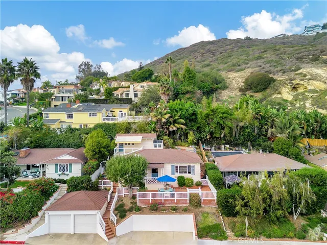 an aerial view of residential houses and outdoor space