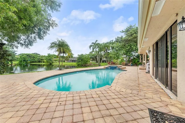 a view of a swimming pool with a fountain
