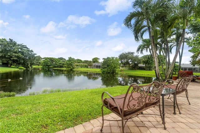 a front view of a building with sitting area