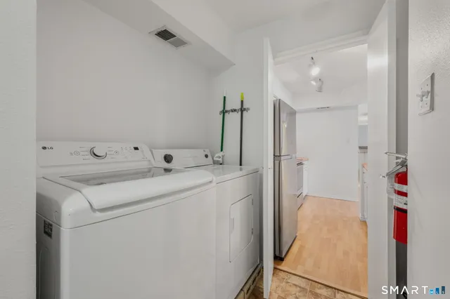a utility room with dryer and washer