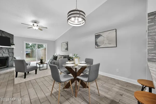 a view of a very nice looking dining room with furniture window and wooden floor