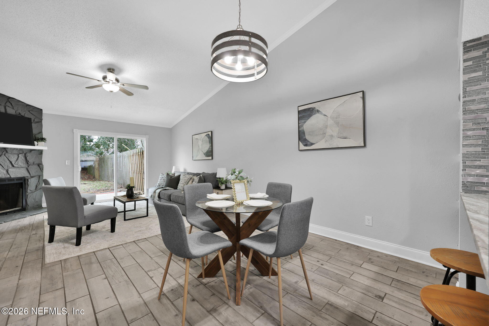 2494 Spring Vale Road Jacksonville, FL 32246 - Photo 12 of 36 a view of a very nice looking dining room with furniture window and wooden floor