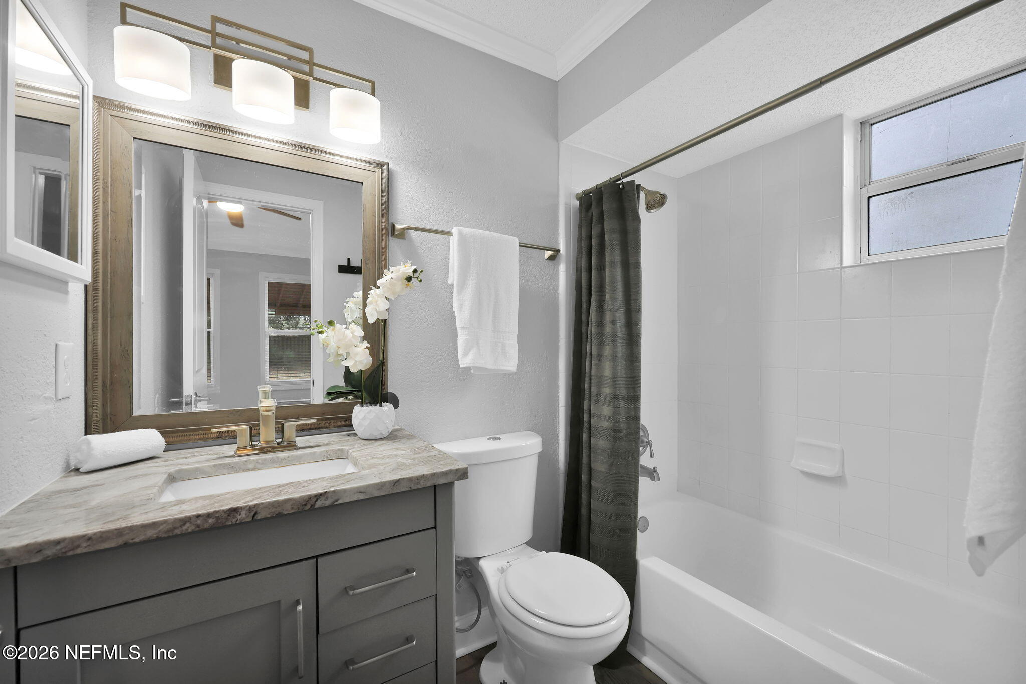 2494 Spring Vale Road Jacksonville, FL 32246 - Photo 20 of 36 a bathroom with a granite countertop sink toilet and shower