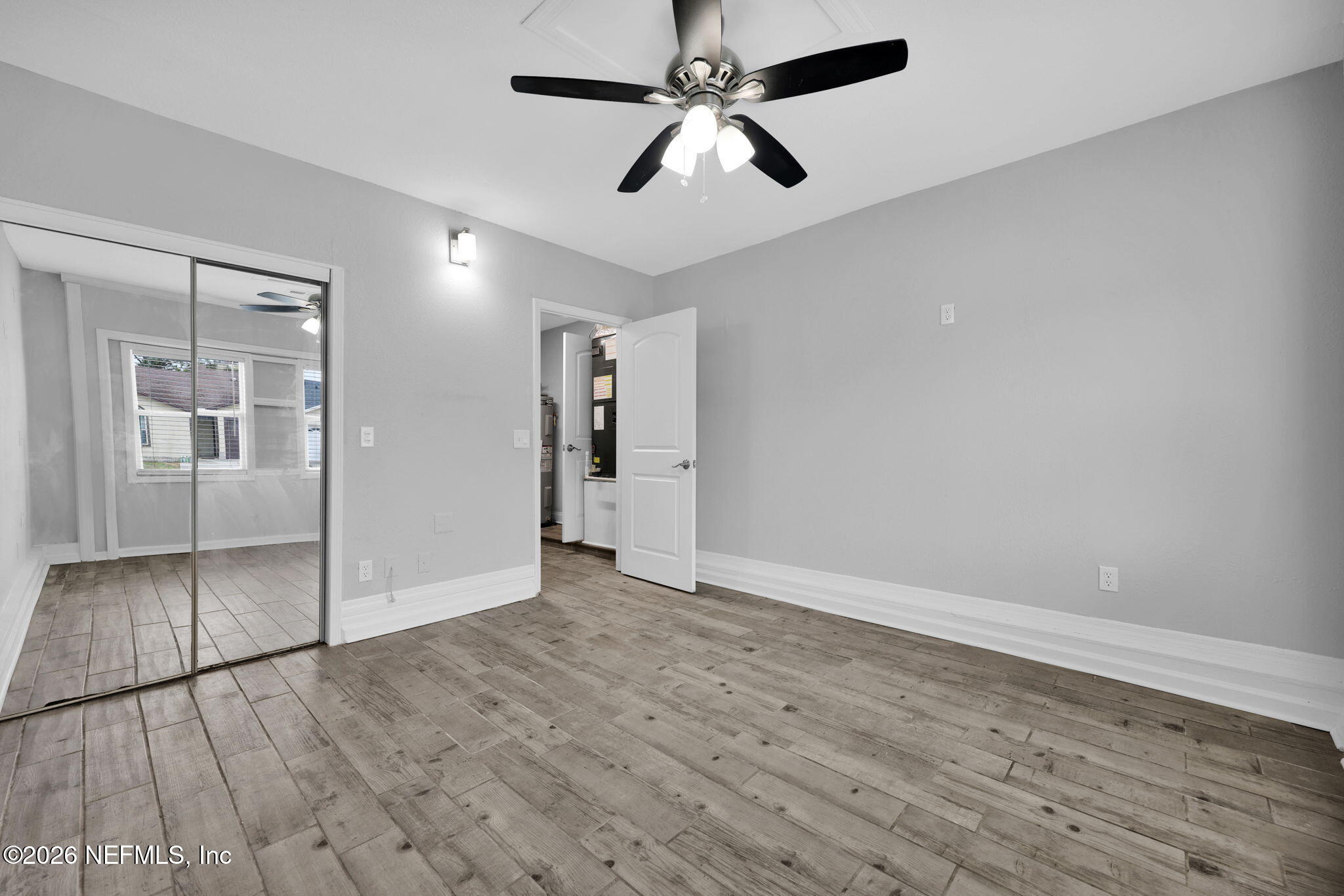 2494 Spring Vale Road Jacksonville, FL 32246 - Photo 28 of 36 a view of empty room with wooden floor
