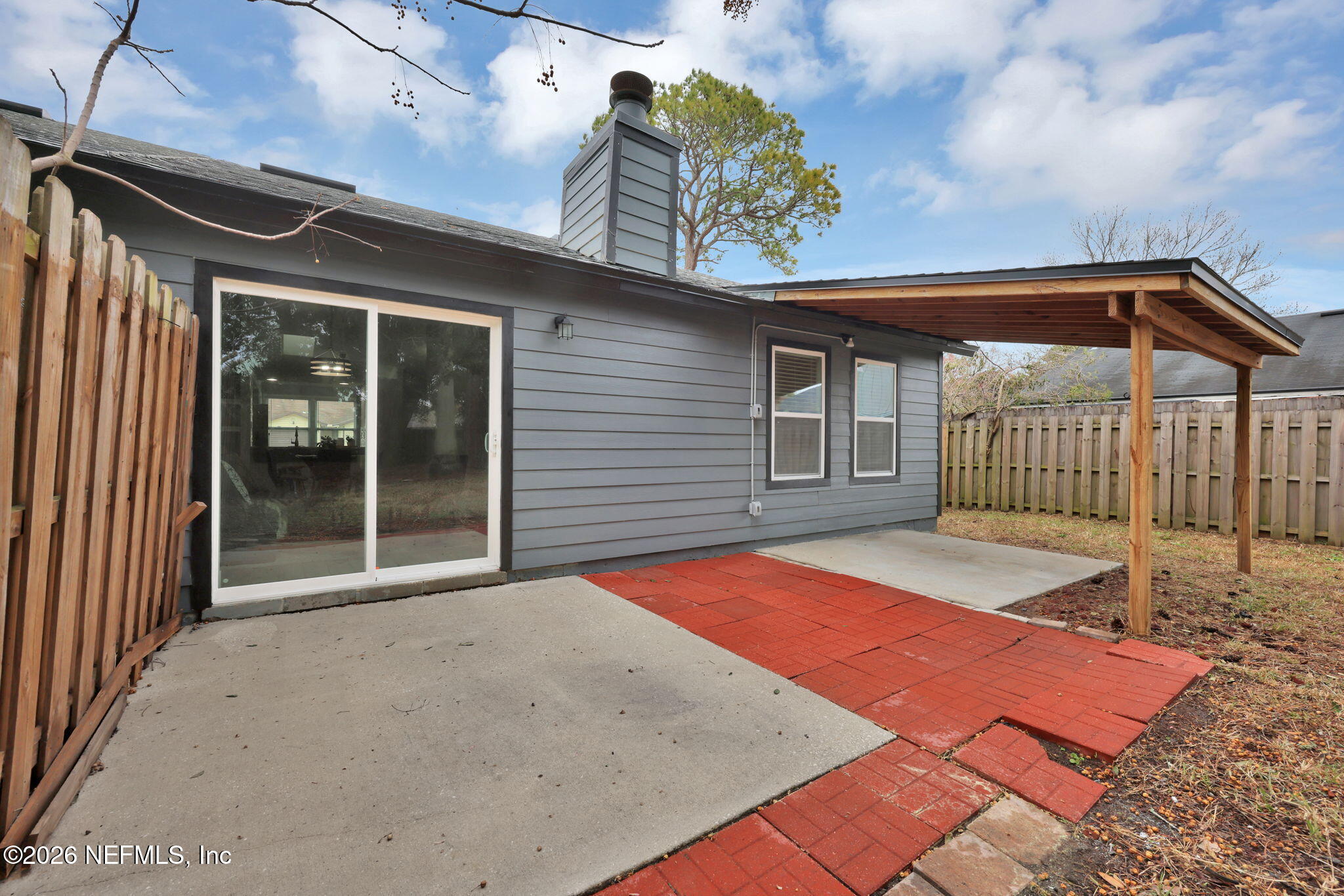 2494 Spring Vale Road Jacksonville, FL 32246 - Photo 30 of 36 a front view of a house with a yard