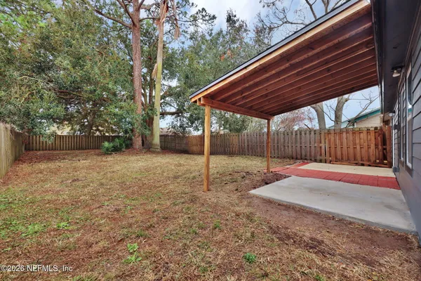 a backyard of a house with lots of green space